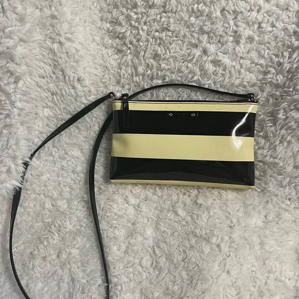 Kate Spade patent Black and Cream Striped small Crossbody Bag.